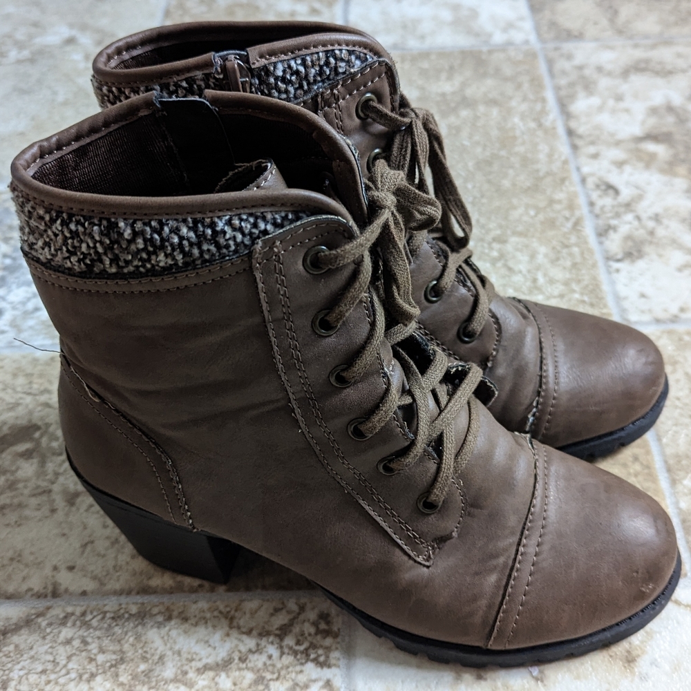Woman’s brown leather heeled boots